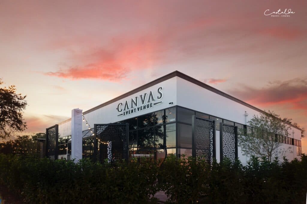 canvas event venue square white building with large windows at sunset